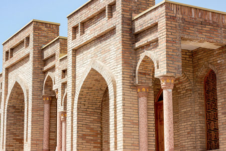 HISOR, TAJIKISTAN - JULY 31, 2022: Ancient Hisor Fort in summer against the blue sky.のeditorial素材