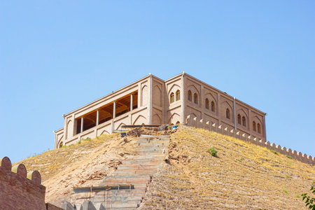 HISOR, TAJIKISTAN - JULY 31, 2022: Ancient Hisor Fort in summer against the blue sky.のeditorial素材