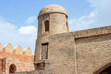 HISOR, TAJIKISTAN - JULY 31, 2022: Ancient Hisor Fort in summer against the blue sky.