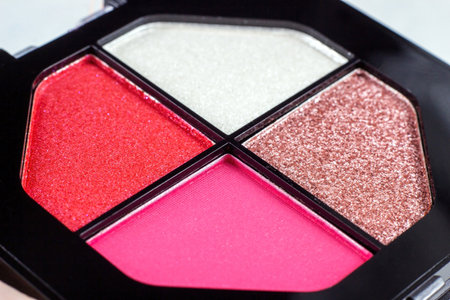 Different colorful facial eyeshadow makeup palette close up.の写真素材