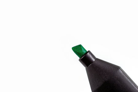 Black marker pen with bright green tip on light background close up with copy space.の写真素材