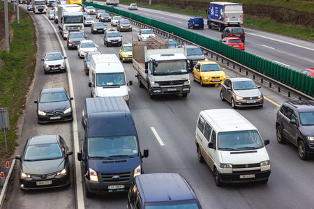 MINSK, BELARUS - NOVEMBER 17, 2022: Traffic jam with many cars on the city street in rush hour.
