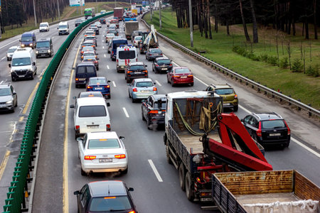MINSK, BELARUS - NOVEMBER 17, 2022: Traffic jam with many cars on the city street in rush hour.