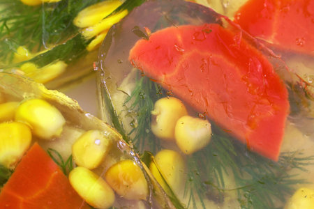 Jellied pork and chicken meat, aspic jelly with vegetables (corn, carrot, dill) close up top view.の写真素材