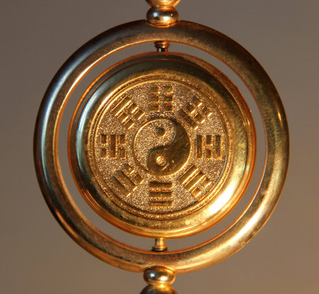 gold yin yang sign surrounded by Trigramsの写真素材