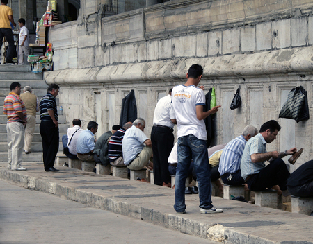ISTANBUL, TURKEY - JUN 28, 2008: Turkish men doing ritual ablutions (washing) before enter the mosque for prayのeditorial素材