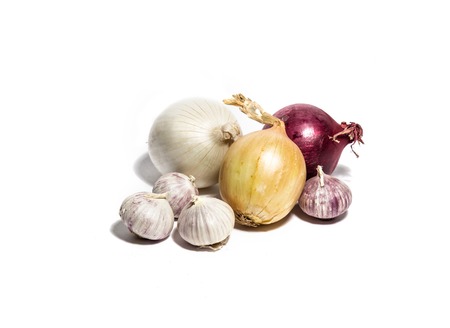 Red, yellow and white onions with garlic isolated on whiteの写真素材