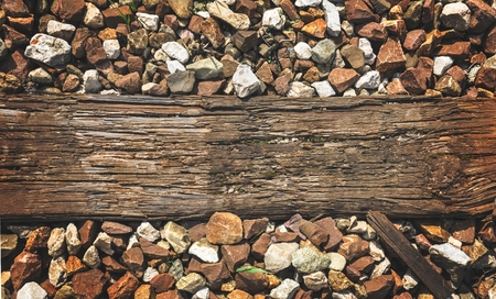 an old piece of wood on the train tracksの写真素材