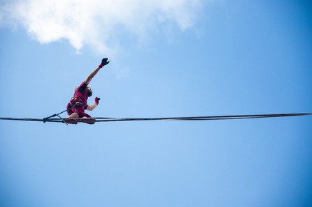 LUBLIN, POLAND- 29 july 2017- slackliner in old town at Urban Highline Festival placed in city space of Lublin - biggest slacklining spectacle in the worldのeditorial素材