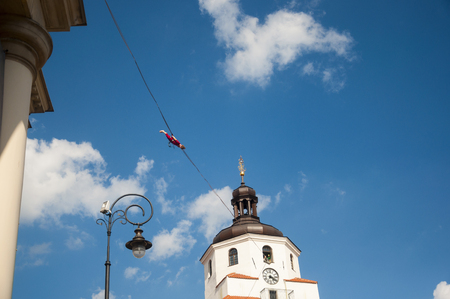 LUBLIN, POLAND- 29 july 2017- slackliner in old town at Urban Highline Festival placed in city space of Lublin - biggest slacklining spectacle in the worldのeditorial素材