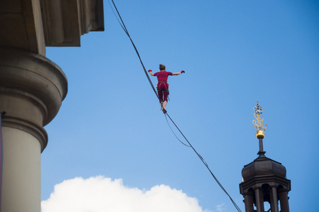 LUBLIN, POLAND- 29 july 2017- slackliner in old town at Urban Highline Festival placed in city space of Lublin - biggest slacklining spectacle in the worldのeditorial素材