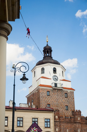 LUBLIN, POLAND- 29 july 2017- slackliner in old town at Urban Highline Festival placed in city space of Lublin - biggest slacklining spectacle in the worldのeditorial素材