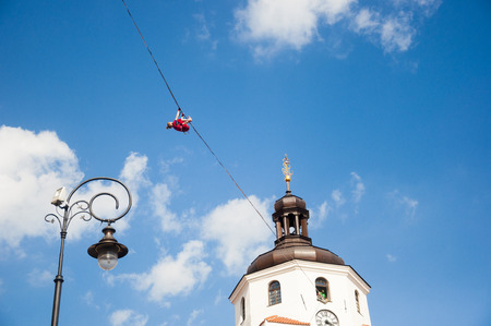 LUBLIN, POLAND- 29 july 2017- slackliner in old town at Urban Highline Festival placed in city space of Lublin - biggest slacklining spectacle in the worldのeditorial素材