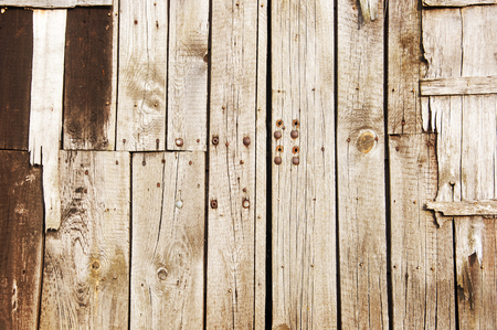 brown old boards of wood making a wallの写真素材