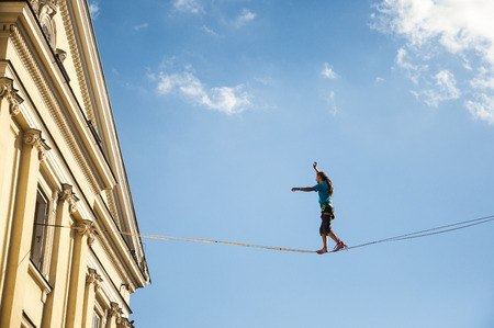Slackliner in old town at Urban Highline Festival placed in city space of Lublin - biggest slacklining spectacle in the worldのeditorial素材