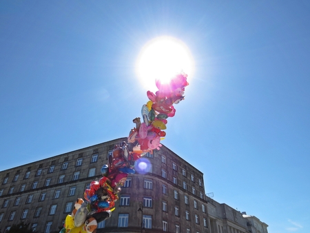 Pile of Helium Filled Flying Balloons for Children with the Sky and Sun in the Background, May 2018, Warsaw Polandのeditorial素材