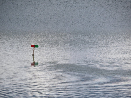 Red and Green Sign for Boats Traffic Visible on a Water Surface