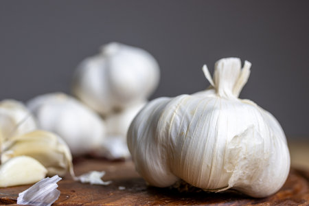 Garlic on a wooden board, close-up, selective focusの写真素材
