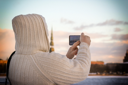 Man in white knit jacket in Riga, Latviaの写真素材