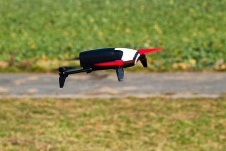 Flying drone with mounted camera in the park.の写真素材