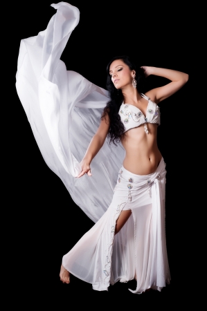 Belly Dancer Dancing with Flowing White Silk Veilの写真素材