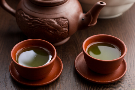 Two cups of matcha tea in a restaurant side viewの写真素材