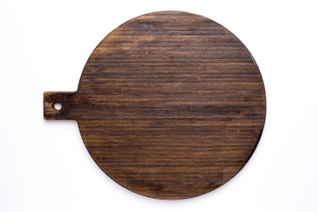 Wooden circle kitchen board on a white background top view isolatedの写真素材