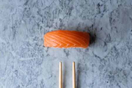 Nigiri Sushi with salmon on marble background top viewの写真素材