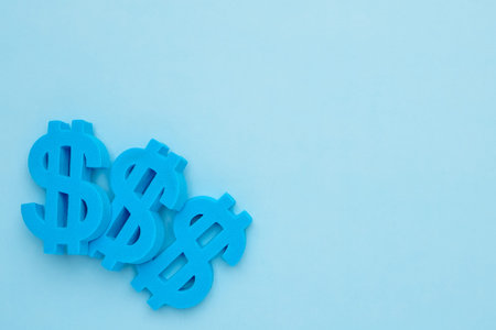 Blue background with american dollar symbol, minimal flatlay top view