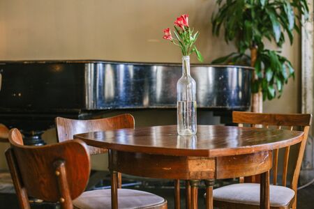 Interior with vintage brown furniture and flower on the table side viewの写真素材