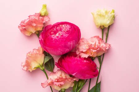 Pink and white flower bouquet on pastel background with copyspaceの写真素材