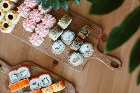 Japanese kitchen rolls on a wooden background, home delivery top viewの写真素材