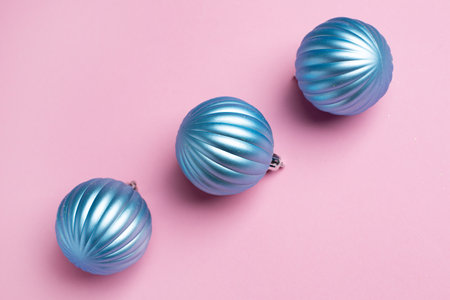 Shiny blue balls on a pink background, Christmas decorationsの写真素材