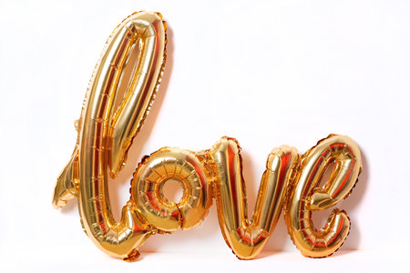 Balloons make people happy, Gold Balloons word love the word love from the heart on white background isolated side viewの写真素材