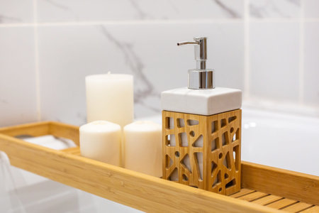 Modern bath room with wooden table and candles. White marble background wall side view