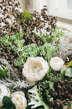 Close up of artificial flowers bouquet arrange for decoration in home, green and white flower side viewの写真素材