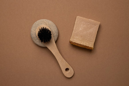 Various spa and beauty threatment products on brown background, eco handmade soup and natural brush in trend color top viewの写真素材