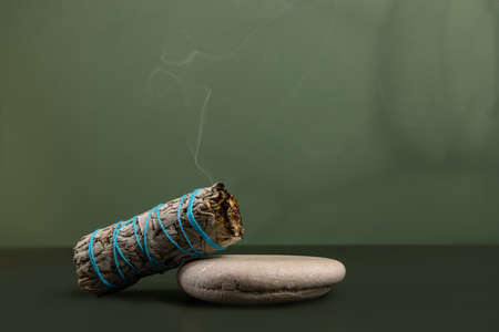 Incense white sage, California dry sage on a green background. Mystical backgroundの写真素材