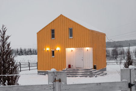 Modern wood house in the Scandinavian style with different color , winter day in villageの写真素材