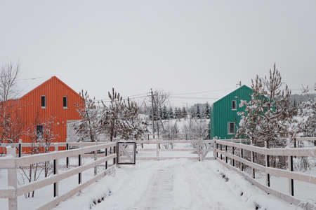 Modern wood house in the Scandinavian style with different color , winter day in villageの写真素材