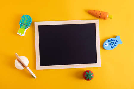 Chalkboard writing board with wooden kid toy for decoration design. Copy space background, child educationの写真素材