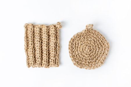Natural washcloth made of craft thread for washing dishes. The concept of waste-free production ,...