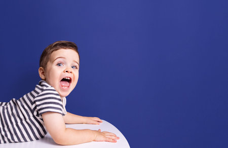 Happy scream toddler boy, great design for any purposes. Young model boy. Happy face isolated on...