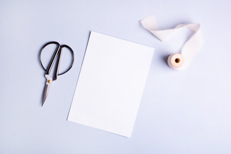 Mockup business card for sewing or textile , tailor or home made. on blue pastel background .の写真素材