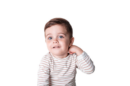 Portrait of happy joyful beautiful little boy isolated on white backgroundの写真素材