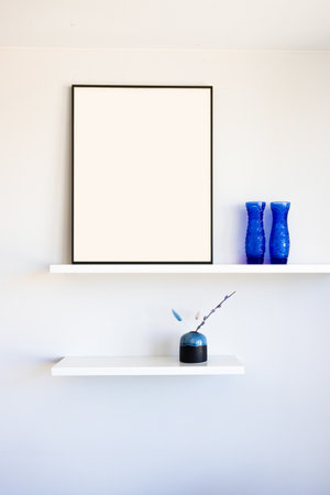 Blank picture frame mockup on a wall. Vertical orientation. Artwork template in interior designの写真素材