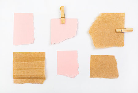 Note paper sticky notes with clothespin on white background, reminder mock upの写真素材