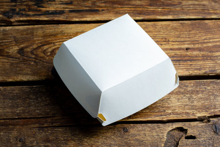 Blank white burger carton box mock up on wooden backgroundの写真素材