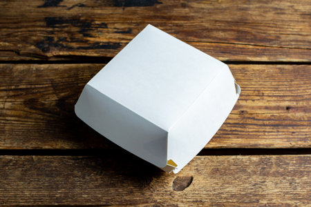 Blank white burger carton box mock up on wooden backgroundの写真素材