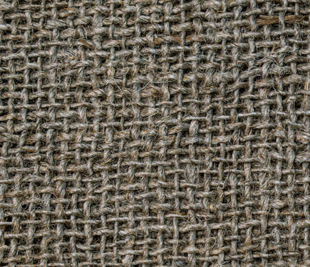 Sack texture background. Textile burlap background. Close-up photo of burlap. The texture of the fibers and threads of the coarse fabric. textile abstraction. Textile brown background.の写真素材